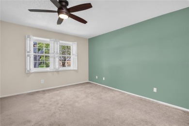 This spacious end-unit villa with serene golf course views is on Highland Lakes Executive Golf Course in Florida - for sale on GolfHomes.com, golf home, golf lot