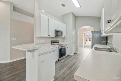 Beautifully updated brick home in desirable Oak Pointe! This on Tiger Point Golf and Country Club in Florida - for sale on GolfHomes.com, golf home, golf lot