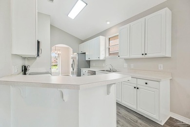 Beautifully updated brick home in desirable Oak Pointe! This on Tiger Point Golf and Country Club in Florida - for sale on GolfHomes.com, golf home, golf lot