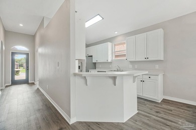 Beautifully updated brick home in desirable Oak Pointe! This on Tiger Point Golf and Country Club in Florida - for sale on GolfHomes.com, golf home, golf lot