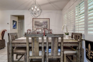 Nestled in the heart of Palm Harbor's sought-after Highland on Highland Lakes Executive Golf Course in Florida - for sale on GolfHomes.com, golf home, golf lot