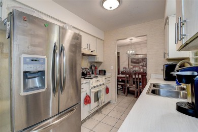 Nestled in the heart of Palm Harbor's sought-after Highland on Highland Lakes Executive Golf Course in Florida - for sale on GolfHomes.com, golf home, golf lot