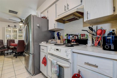 Nestled in the heart of Palm Harbor's sought-after Highland on Highland Lakes Executive Golf Course in Florida - for sale on GolfHomes.com, golf home, golf lot