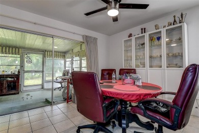 Nestled in the heart of Palm Harbor's sought-after Highland on Highland Lakes Executive Golf Course in Florida - for sale on GolfHomes.com, golf home, golf lot
