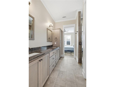 Enjoy resort-style living in National Village at the Robert on Grand National Golf Course in Alabama - for sale on GolfHomes.com, golf home, golf lot