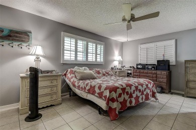 Nestled in the heart of Palm Harbor's sought-after Highland on Highland Lakes Executive Golf Course in Florida - for sale on GolfHomes.com, golf home, golf lot