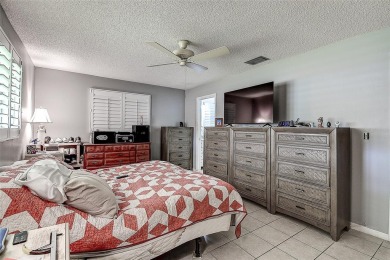 Nestled in the heart of Palm Harbor's sought-after Highland on Highland Lakes Executive Golf Course in Florida - for sale on GolfHomes.com, golf home, golf lot