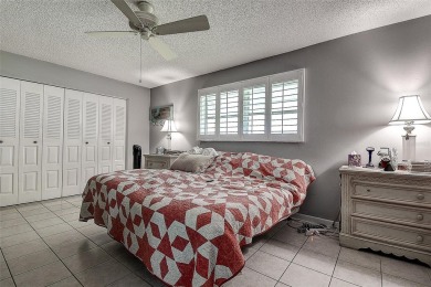 Nestled in the heart of Palm Harbor's sought-after Highland on Highland Lakes Executive Golf Course in Florida - for sale on GolfHomes.com, golf home, golf lot