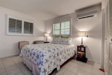 Nestled in the heart of Palm Harbor's sought-after Highland on Highland Lakes Executive Golf Course in Florida - for sale on GolfHomes.com, golf home, golf lot