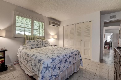 Nestled in the heart of Palm Harbor's sought-after Highland on Highland Lakes Executive Golf Course in Florida - for sale on GolfHomes.com, golf home, golf lot