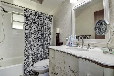 Nestled in the heart of Palm Harbor's sought-after Highland on Highland Lakes Executive Golf Course in Florida - for sale on GolfHomes.com, golf home, golf lot