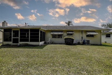 Nestled in the heart of Palm Harbor's sought-after Highland on Highland Lakes Executive Golf Course in Florida - for sale on GolfHomes.com, golf home, golf lot