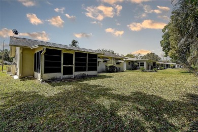 Nestled in the heart of Palm Harbor's sought-after Highland on Highland Lakes Executive Golf Course in Florida - for sale on GolfHomes.com, golf home, golf lot