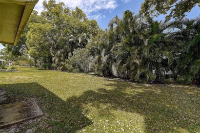 Nestled in the heart of Palm Harbor's sought-after Highland on Highland Lakes Executive Golf Course in Florida - for sale on GolfHomes.com, golf home, golf lot