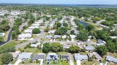 Nestled in the heart of Palm Harbor's sought-after Highland on Highland Lakes Executive Golf Course in Florida - for sale on GolfHomes.com, golf home, golf lot