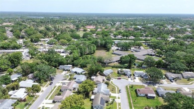Nestled in the heart of Palm Harbor's sought-after Highland on Highland Lakes Executive Golf Course in Florida - for sale on GolfHomes.com, golf home, golf lot