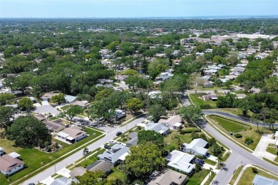 Nestled in the heart of Palm Harbor's sought-after Highland on Highland Lakes Executive Golf Course in Florida - for sale on GolfHomes.com, golf home, golf lot