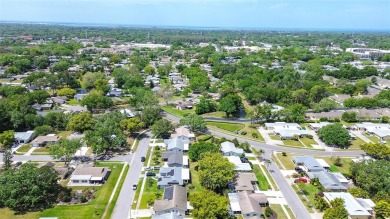 Nestled in the heart of Palm Harbor's sought-after Highland on Highland Lakes Executive Golf Course in Florida - for sale on GolfHomes.com, golf home, golf lot