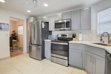 STOP SEARCHING! YOU FOUND THIS SPARKLING UPDATED CORNER CONDO on Poinciana Golf Club in Florida - for sale on GolfHomes.com, golf home, golf lot