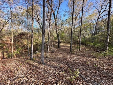 Discover the natural beauty of this 4.31-acre property, located on Bella Vista - Metfield Golf Complex and Country Club in Arkansas - for sale on GolfHomes.com, golf home, golf lot