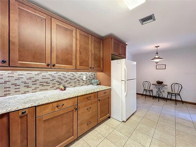 Welcome to your serene waterfront retreat in the highly on Tuscawilla Country Club in Florida - for sale on GolfHomes.com, golf home, golf lot