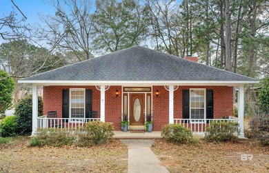 This classic Southern house sits on a corner lot in the heart of on Lake Forest Yacht and Country Club in Alabama - for sale on GolfHomes.com, golf home, golf lot