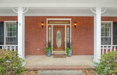This classic Southern house sits on a corner lot in the heart of on Lake Forest Yacht and Country Club in Alabama - for sale on GolfHomes.com, golf home, golf lot