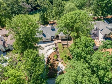 Tucked in Atlanta Country Club's quiet interior, this European on Atlanta Country Club in Georgia - for sale on GolfHomes.com, golf home, golf lot