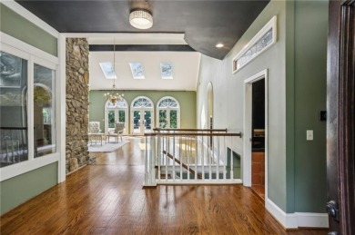 Tucked in Atlanta Country Club's quiet interior, this European on Atlanta Country Club in Georgia - for sale on GolfHomes.com, golf home, golf lot