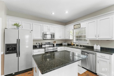 This classic Southern house sits on a corner lot in the heart of on Lake Forest Yacht and Country Club in Alabama - for sale on GolfHomes.com, golf home, golf lot