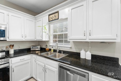 This classic Southern house sits on a corner lot in the heart of on Lake Forest Yacht and Country Club in Alabama - for sale on GolfHomes.com, golf home, golf lot