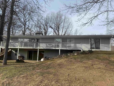 This charming 3-bedroom, 2.5-bath home sits on Lake Omaha in on Cherokee Village South Course in Arkansas - for sale on GolfHomes.com, golf home, golf lot