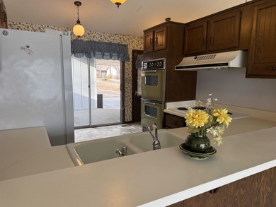 This charming 3-bedroom, 2.5-bath home sits on Lake Omaha in on Cherokee Village South Course in Arkansas - for sale on GolfHomes.com, golf home, golf lot