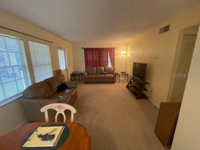2 Bedroom and 2 Bathroom upstairs CONDO, Nestled within a on Country Club At Silver Springs Shores in Florida - for sale on GolfHomes.com, golf home, golf lot