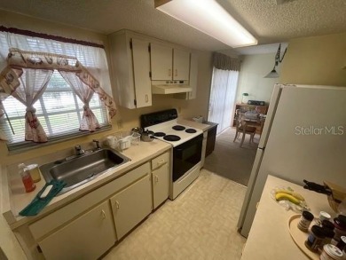 2 Bedroom and 2 Bathroom upstairs CONDO, Nestled within a on Country Club At Silver Springs Shores in Florida - for sale on GolfHomes.com, golf home, golf lot
