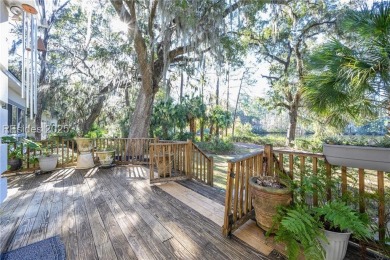 Enjoy the incredible sunset views of a large lagoon and bird on Callawassie Island Club in South Carolina - for sale on GolfHomes.com, golf home, golf lot