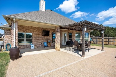 Discover the perfect blend of luxury & lifestyle in this on Pecan Plantation Country Club in Texas - for sale on GolfHomes.com, golf home, golf lot