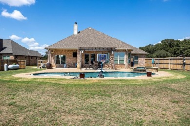 Discover the perfect blend of luxury & lifestyle in this on Pecan Plantation Country Club in Texas - for sale on GolfHomes.com, golf home, golf lot