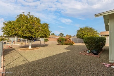 Energy-efficient home in Sun City showcases a large front yard on Sun City Riverview Golf Course in Arizona - for sale on GolfHomes.com, golf home, golf lot