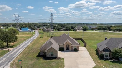 Discover the perfect blend of luxury & lifestyle in this on Pecan Plantation Country Club in Texas - for sale on GolfHomes.com, golf home, golf lot