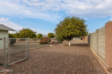 Energy-efficient home in Sun City showcases a large front yard on Sun City Riverview Golf Course in Arizona - for sale on GolfHomes.com, golf home, golf lot