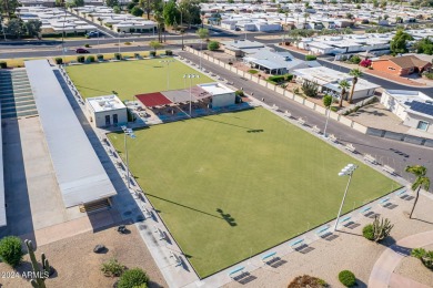 Energy-efficient home in Sun City showcases a large front yard on Sun City Riverview Golf Course in Arizona - for sale on GolfHomes.com, golf home, golf lot