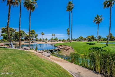 Energy-efficient home in Sun City showcases a large front yard on Sun City Riverview Golf Course in Arizona - for sale on GolfHomes.com, golf home, golf lot