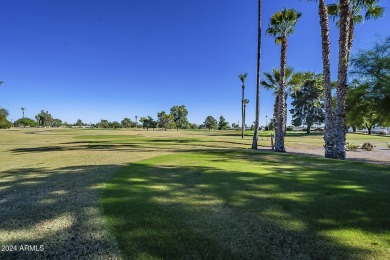 Energy-efficient home in Sun City showcases a large front yard on Sun City Riverview Golf Course in Arizona - for sale on GolfHomes.com, golf home, golf lot