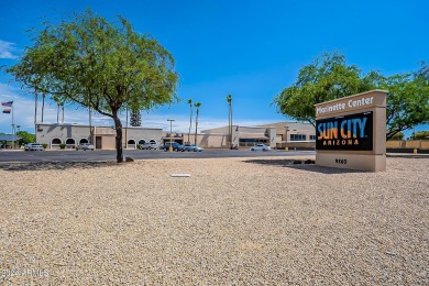 Energy-efficient home in Sun City showcases a large front yard on Sun City Riverview Golf Course in Arizona - for sale on GolfHomes.com, golf home, golf lot