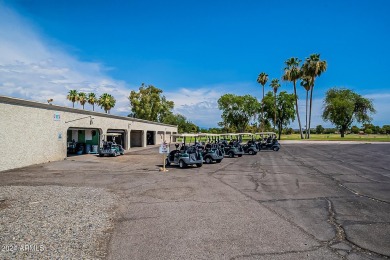 Energy-efficient home in Sun City showcases a large front yard on Sun City Riverview Golf Course in Arizona - for sale on GolfHomes.com, golf home, golf lot