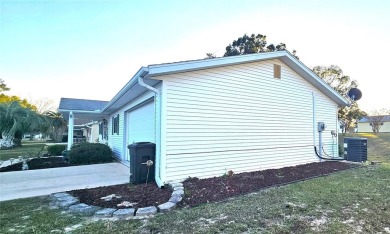 This two-bedroom, two-bath split-bedroom plan home is located in on Royal Oaks Golf Club in Florida - for sale on GolfHomes.com, golf home, golf lot