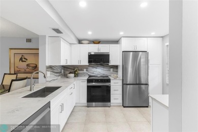 Absolutely Stunning Remodel! Feel the Luxury at the prestigious on Wynmoor Golf Course in Florida - for sale on GolfHomes.com, golf home, golf lot