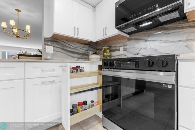 Absolutely Stunning Remodel! Feel the Luxury at the prestigious on Wynmoor Golf Course in Florida - for sale on GolfHomes.com, golf home, golf lot