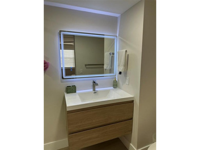 Beautifully renovated condo located in the desirable gated on Sunrise Lakes Phase IV Golf Course in Florida - for sale on GolfHomes.com, golf home, golf lot